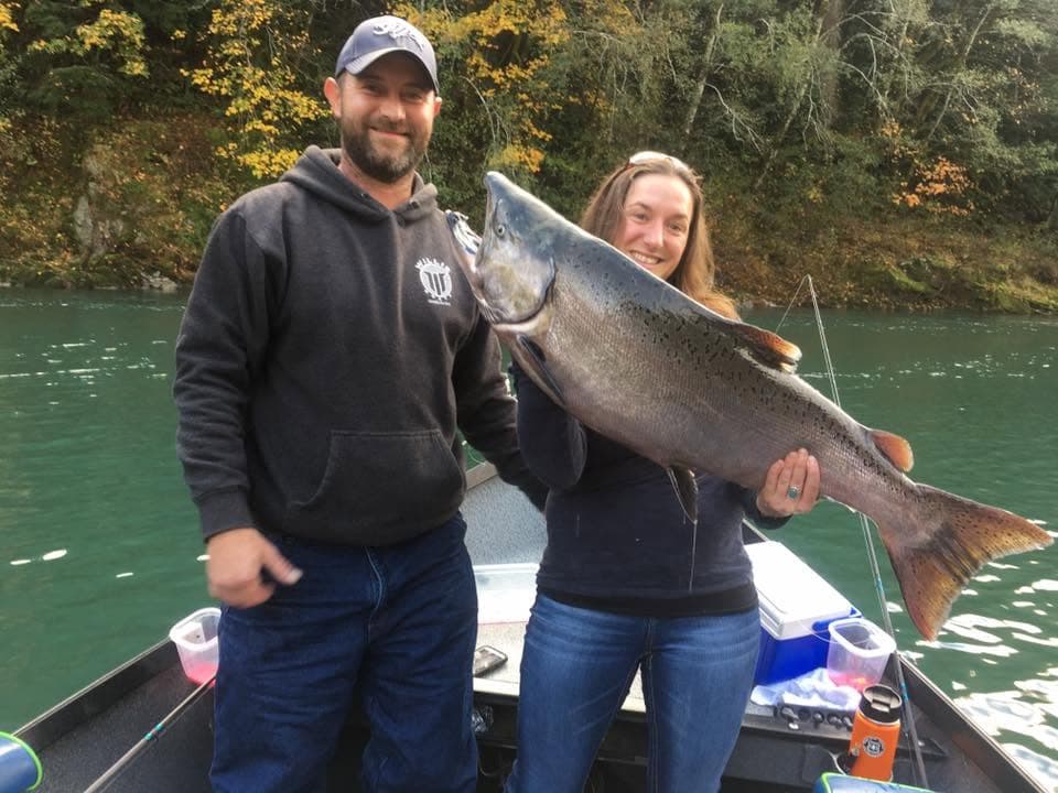 Angler holding a chrome salmon